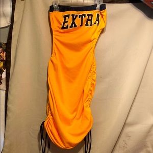 Orange dress, strapless, cut out sides to accentuate the waist